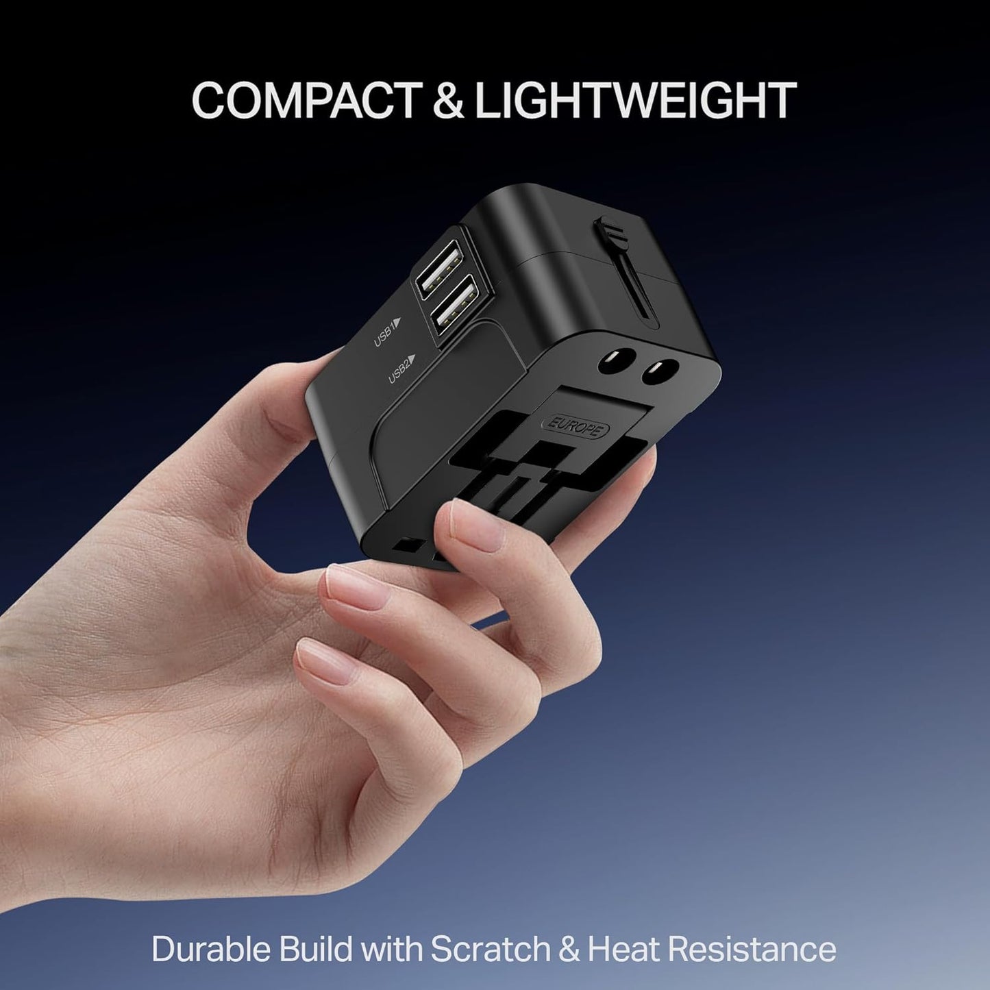 boAt universal travel adapter held in hand showing compact lightweight design with dual USB ports