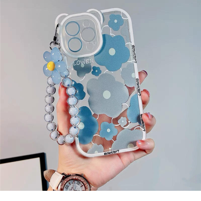 A woman presents a blue flower case with a watch and bracelet, promoting products available at grunxstore.