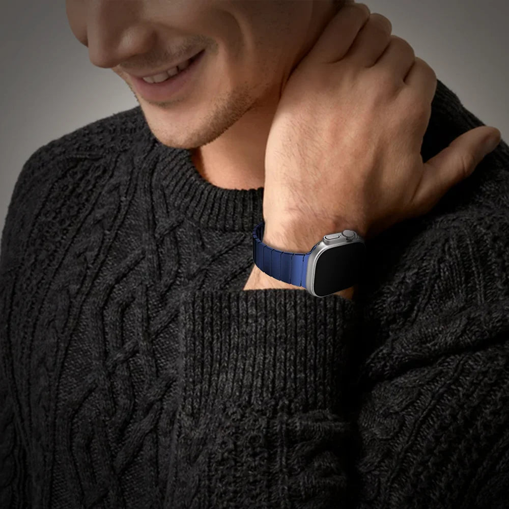Man wearing GRUNX Ghost ultra thin steel Apple Watch strap blue on wrist Indian lifestyle urban setting