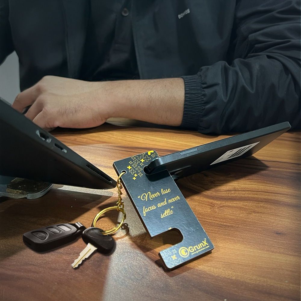 Mobile Stand and Keychain Smartphones Adjustable Black & Yellow Stand Holding a Smartphone and Keys Pushpa Grunx in India