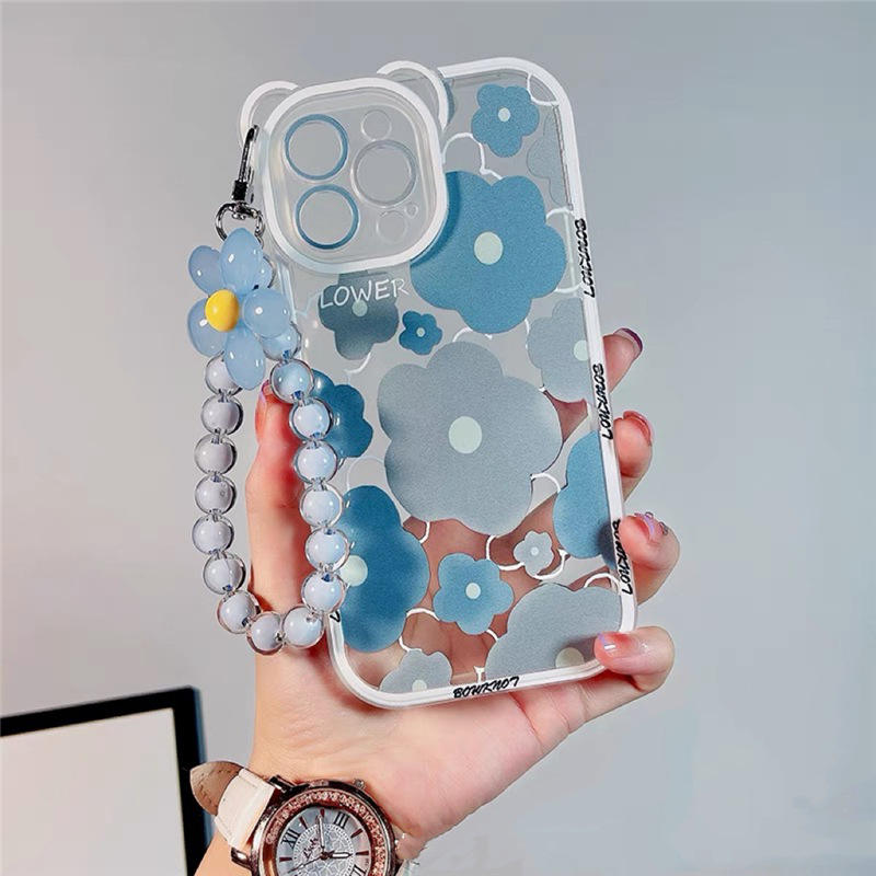 A woman displays a blue flower case with a watch and bracelet, showcasing products from grunxstore.