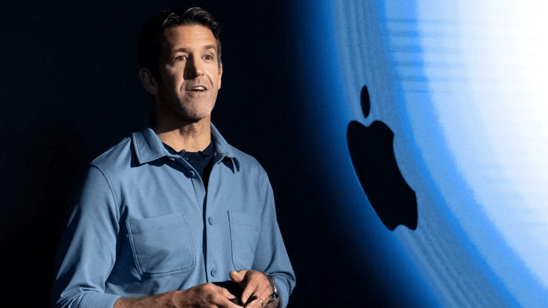 Apple senior vice president delivering keynote speech on stage with Apple logo backdrop at product event