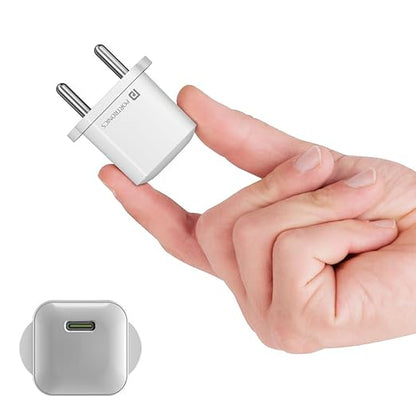 Portronics Adapto 20 Lite white compact 20W Type-C PD wall charger held between fingers showing small size