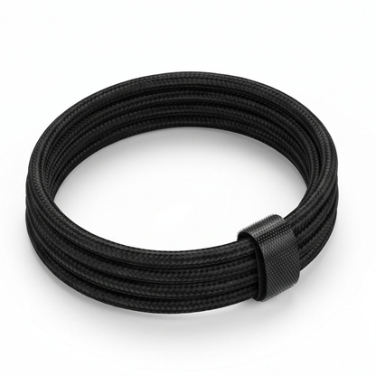 3-in-1 AUX cable coiled in a circle on white background