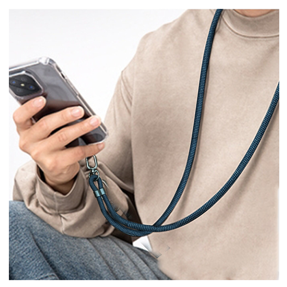 A person with a navy blue 4 in 1 lanyard charging cable around their neck is holding a cell phone, focused on the device in their hand.