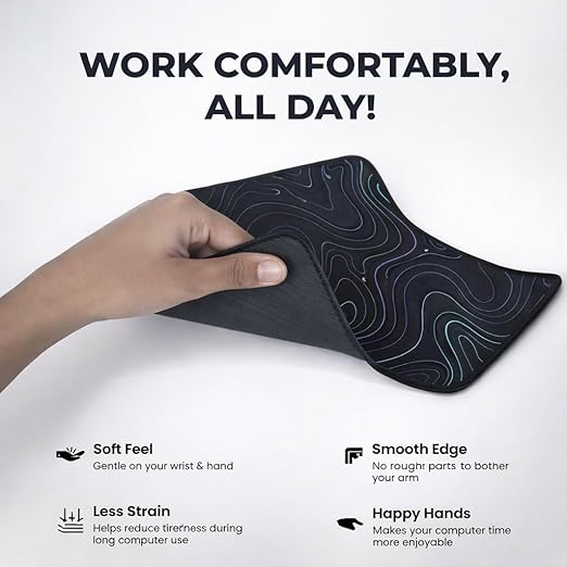 Hand holding flexible black extended mouse pad showing soft feel and smooth stitched edges for comfortable all-day use