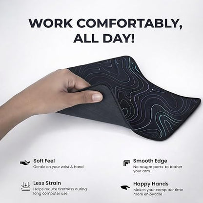 Hand holding flexible black extended mouse pad showing soft feel and smooth stitched edges for comfortable all-day use