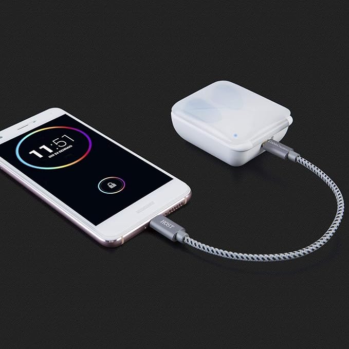 Short Micro USB OTG Cable connecting smartphone to wireless Bluetooth speaker for audio playback and charging