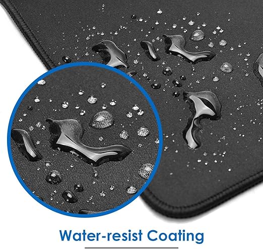 Water droplets beading on water-resistant coated black gaming mouse pad surface close-up macro view