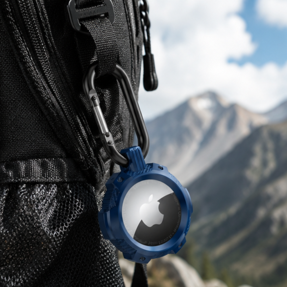 Apple AirTag in a blue carabiner clip case attached to the zipper strap of a black backpack, shown against a scenic mountain landscape background