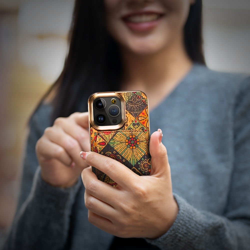  A woman displays a patterned phone case, promoting the iPhone 16 Case available at grunxstore.com.