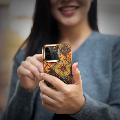  A woman displays a patterned phone case, promoting the iPhone 16 Case available at grunxstore.com.