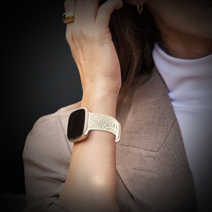 An Apple Watch with a pink strap and a floral image, exemplifying trendy Apple Watch strap options