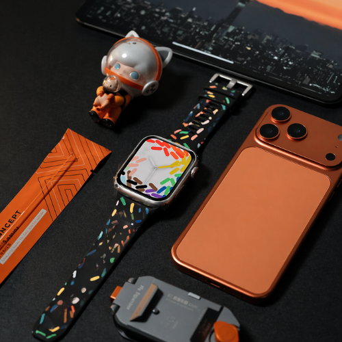 Colorful silicone smartwatch band featuring bright orange and black stripe pattern, displaying bold contrasting design with premium silicone material