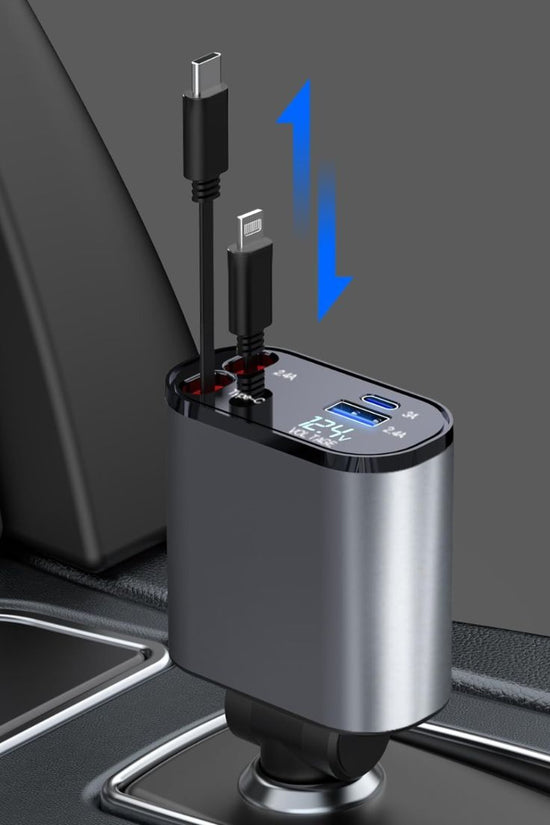 Grunx Cool Pro 4‑in‑1 car charger plugged into vehicle socket, metallic body with dual retractable cables visible, illuminated LED display showing voltage