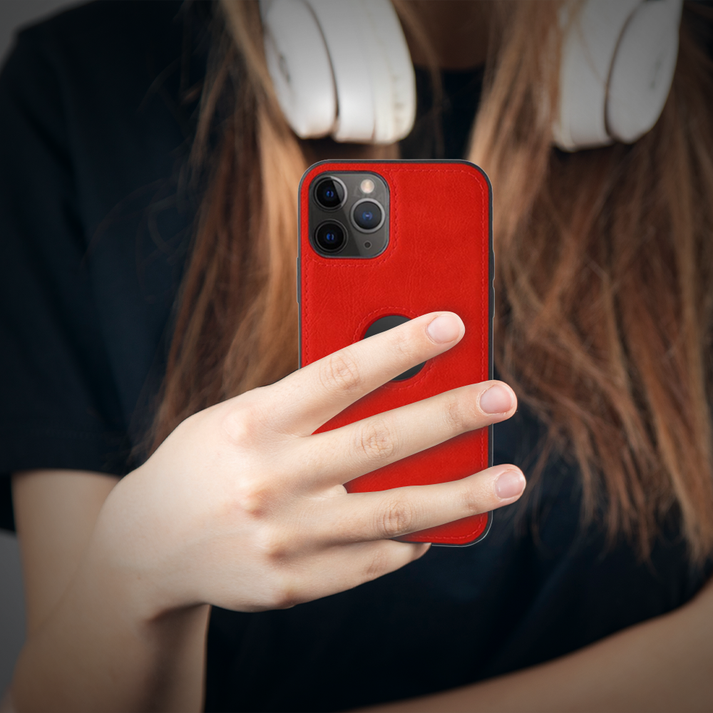 A woman with headphones holds a red iPhone, showcasing the latest iPhone 16 case available at grunxstore.com.