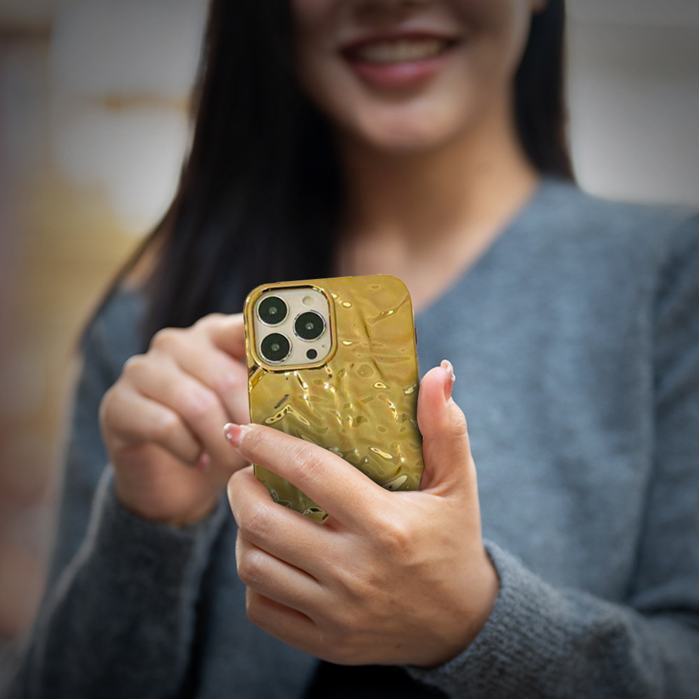 Golden iPhone case mockup showcasing sleek design, available online at grunxstore.com.