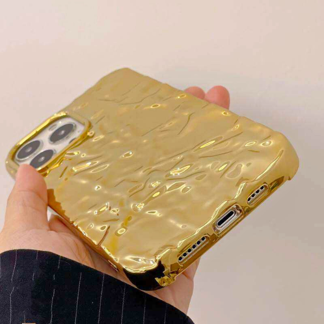 A reflective gold iPhone case shown on Grunxstore, perfect for adding a touch of elegance to your phone.