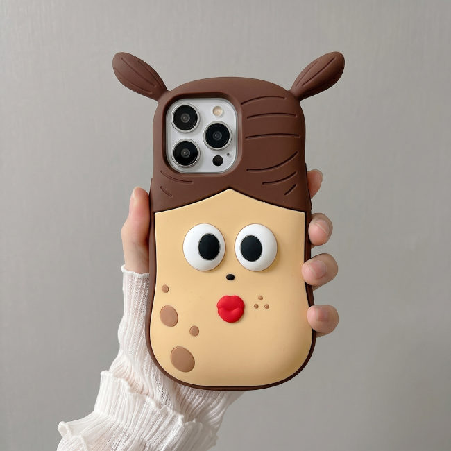 GRUNX Pooky Pigtail Girl 3D cartoon iPhone case held by young Indian woman iPhone 16 series showing cute brown character design