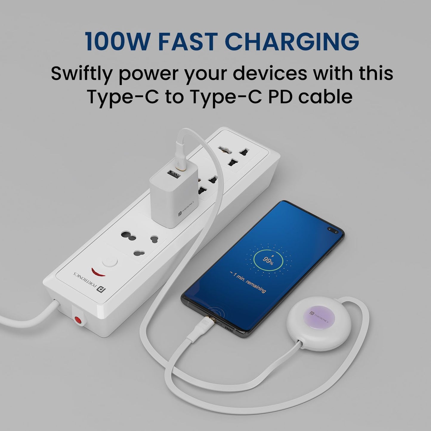 Portronics retractable Type-C to Type-C PD cable 100W fast charging smartphone connected to power strip showing 99 percent battery