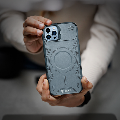 A person showcasing an iPhone 16 case with a ring, available online at grunxstore.com.