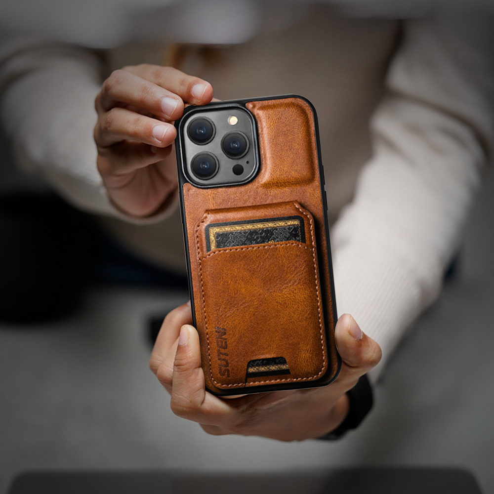 A person displaying a leather iPhone case, showcasing its design and quality, available at grunxstore.com.