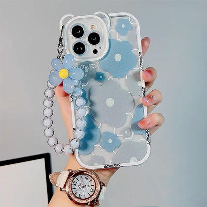 A woman displays a blue flower case with a watch and bracelet, showcasing products from grunxstore.