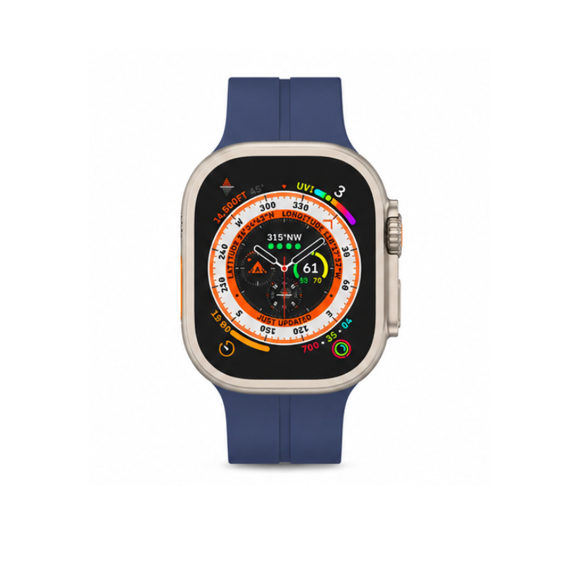 Front product view of Apple Watch Ultra with navy blue silicone sport band displaying a circular compass watch face on a white background