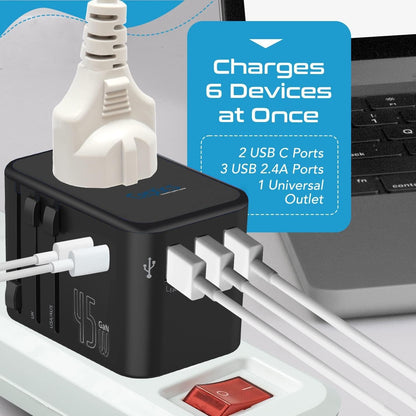45W travel adapter plugged into power strip charging multiple devices next to a laptop