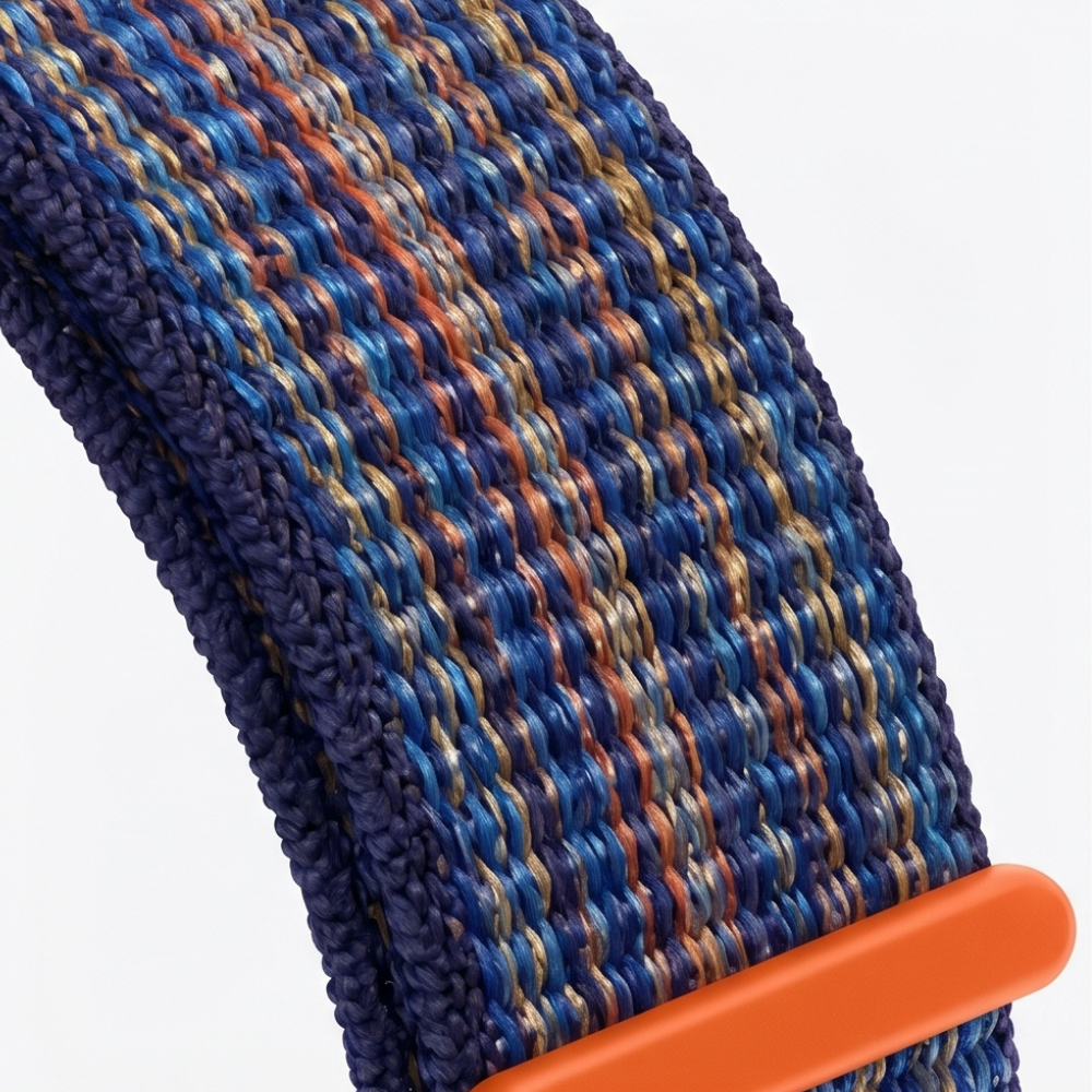 Smartwatch with colorful patterned textile band featuring blue and orange stripes, showing stylish customization option