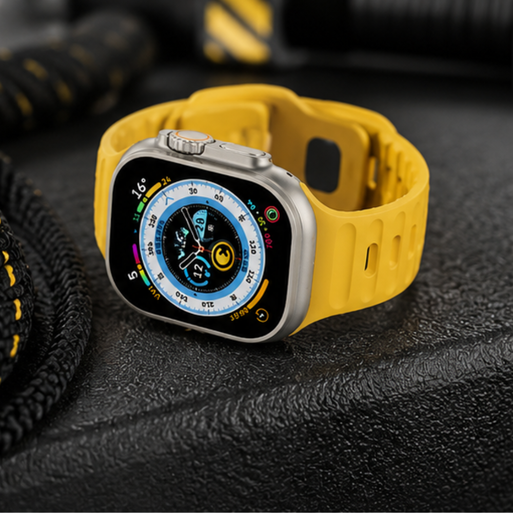 Apple Watch Ultra with bright yellow rubber sport band standing upright on a dark rocky surface outdoors, showing the compass watch face