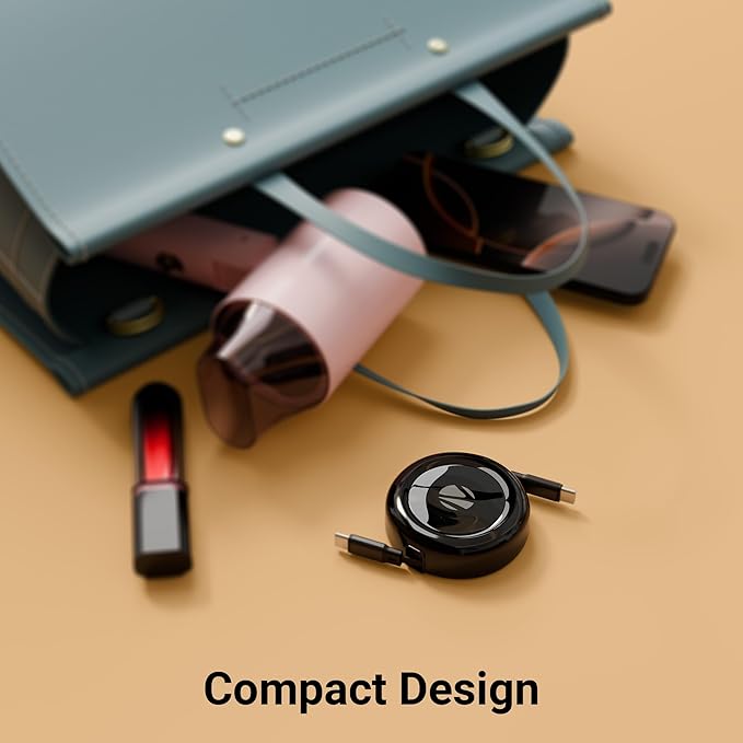 Zebronics compact retractable Type-C to Type-C cable black round disc design next to handbag portable travel friendly