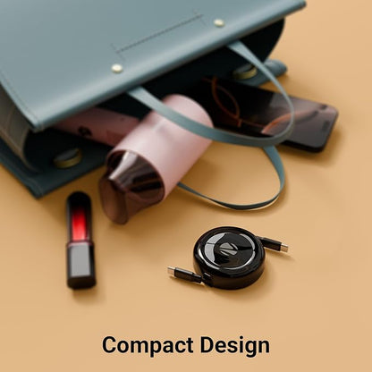 Zebronics compact retractable Type-C to Type-C cable black round disc design next to handbag portable travel friendly