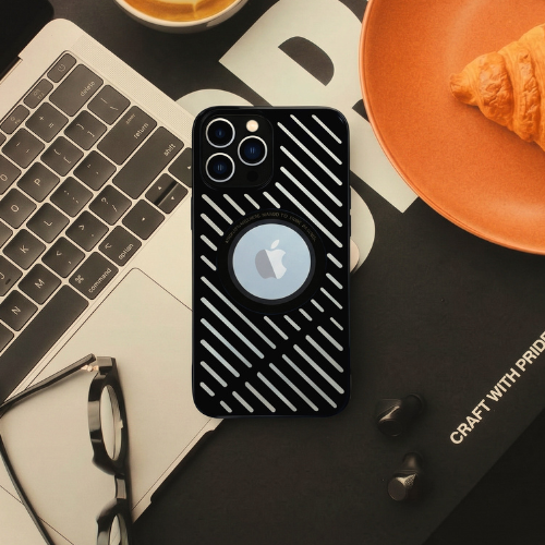 GrunX Metal iPhone Case Black – MagSafe Compatible Diagonal Stripe Design, Lifestyle Flat Lay with MacBook Glasses and Croissant, Craft with Pride